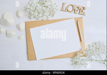 Mockup envelope with flowers and hearts for letter, place for text Stock Photo