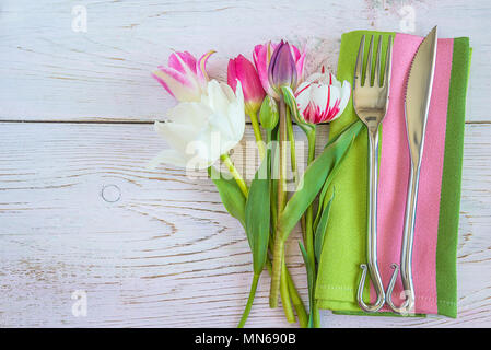 Table setting with fresh tulips Stock Photo