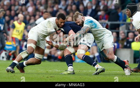 LONDON, ENGLAND - MARCH 11: Courtney Lawes and Joe Marler of England crunching tackle on Scotland's Ryan Wilson during the match between England v Scotland RBS Six Nations Tournament at Twickenham Stadium on March 11, 2017 in London, England. Stock Photo
