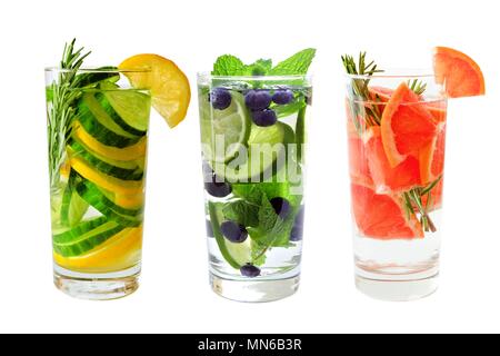 Three types of fruit detox water in glasses isolated on a white background Stock Photo