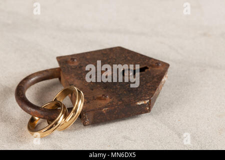 Eternal love symbolized by rings in a padlock Stock Photo