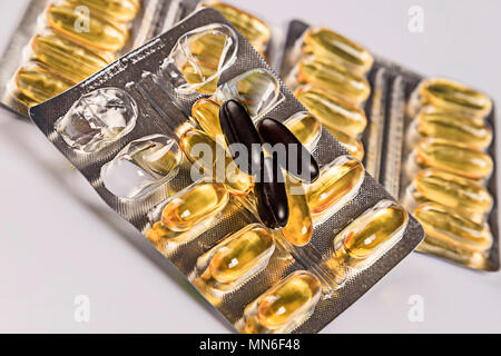 Yellow and Black Pills Blister pack Stock Photo