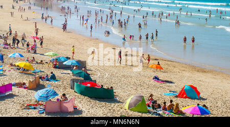 BALEAL, PORTUGAL - JUL 30, 2017: People at the ocean beach in a high peak season. Portugal famous tourist destination for it’s ocean beaches. Stock Photo