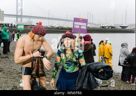 South Queensferry, UK. Hundreds of people take part in the Loony Dook in South Queensferry near Edinburgh. Stock Photo