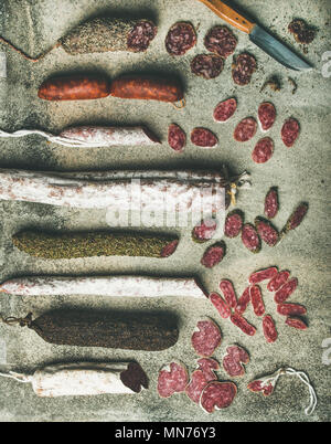 Variety of Spanish or Italian cured sausages cut in slices Stock Photo