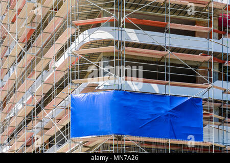 Blank space on a scaffolding building for your advertising. blue mockup Stock Photo