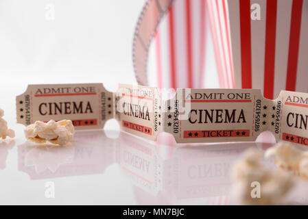 Conceptual objects of cinema on white table and background close up. Concept of watching movies. Horizontal composition. Front view. Stock Photo