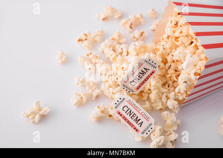Cinema moments concept with popcorn and movie tickets on white background. Horizontal composition. Top view. Stock Photo