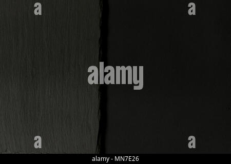 View of a rectangular tray of slate on a black board. Top view. Stock Photo