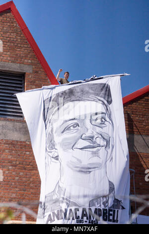 Filton, Bristol, UK . 15th May, 2018. Banner portraits of women killed fighting in syria have been hung from the roof of the airbus company in Filton.The protesters say they are friends of Anna Campbell, from Bristol, who died in syria. The protesters believe Airbus is selling arms to the turkish military and that the women on the banners were killed by turkish forces. BAe has issued a statement that their work with turkey complies with defence export controls. Credit: Mr Standfast/Alamy Live News Credit: Stock Photo