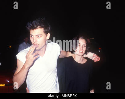 LOS ANGELES, CA - AUGUST 18: (L-R) Actor Johnny Depp and actress Winona Ryder attend Herb Ritt's Birthday Party on August 18, 1990 in Los Angeles, California. Photo by Barry King/Alamy Stock Photo Stock Photo