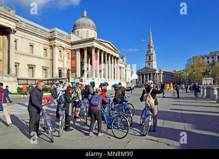 London, England, UK. Organised cycling tour by the National Gallery in Trafalgar Square Stock Photo