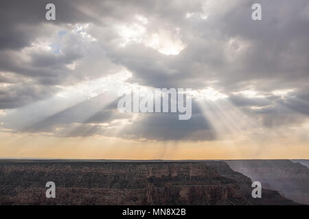 Sun rays coming through clouds in the Grand Canyon Stock Photo