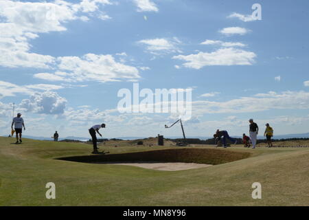 MUIRFIELD, SCOTLAND - JULY 18: Tiger Woods, Louis Oosthuizen and Graeme McDowell at the 5th green during the first round of The Open Championship 2013 at Muirfield Golf Club on July 18, 2013 in Scotland. Stock Photo