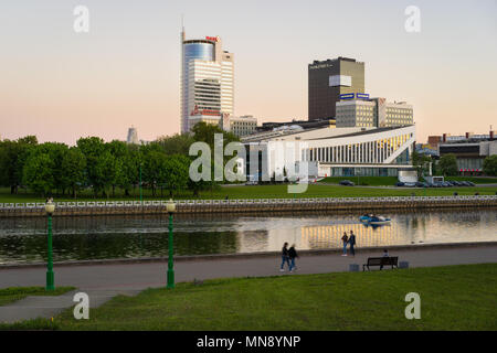 Minsk, Belarus - May 7 2018: Pobediteley Avenue at sunset viewed from Central Park. Svislach River embankment, Minsk City Center Stock Photo