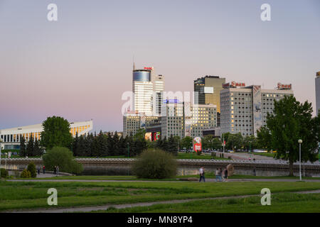 Minsk, Belarus - May 7 2018: Pobediteley Avenue at sunset viewed from Central Park. Svislach River embankment, Minsk City Center Stock Photo