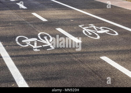Separate bicycle lane for riding bicycles. White painted bike on ...