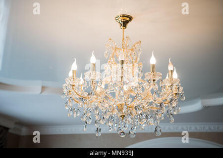 beautiful vintage crystal chandelier in a room Stock Photo