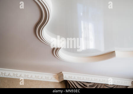 ceiling decoration is made of white plaster. embossed stucco interior Stock Photo