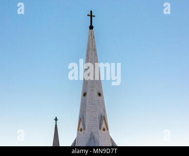 Tall church steeple with cross on top aganist a clear blue sky Stock ...