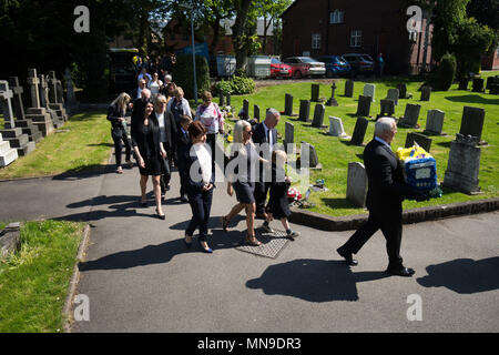 An ice cream van floral tribute is carried by mourners as they arrive at Erdington's Abbey Church, Birmingham for the funeral of Mac Leask, 82, 'the king of scoops', who was Birmingham's longest serving ice-cream man. Stock Photo