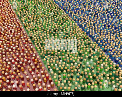 Crowd of small symbolic figures, red, green and blue color groups, 3d illustration, horizontal Stock Photo