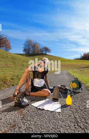 portrait of a homeless housewife who irons in the road Stock Photo