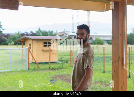 italian young smiling man in his garden Stock Photo