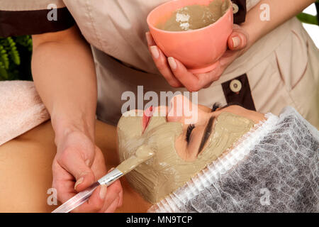 Collagen face mask. Facial skin treatment. Woman receiving cosmetic procedure. Stock Photo
