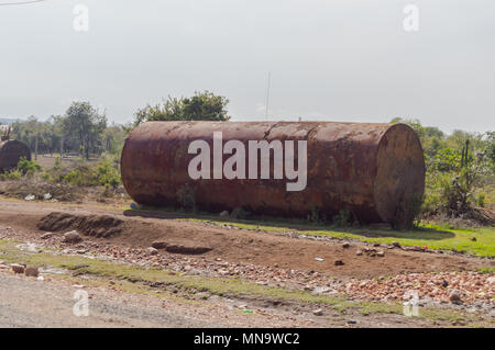 Old rusty tanker on a dirt road from Masai Mara Park in northwestern Kenya Stock Photo