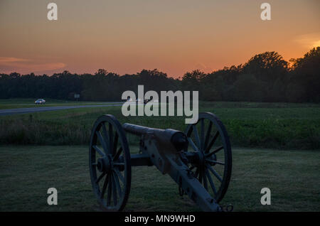 Sun sets over a Civil War era cannon at the Chancellorsville battlefield near Fredericksburg, Virginia. Stock Photo