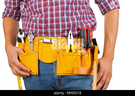 Close up picture of young handyman's yellow tool belt on isolated background Stock Photo