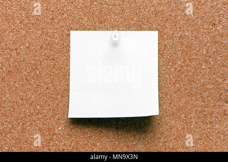 empty square white pinned sheet on a brown cork reminder Stock Photo