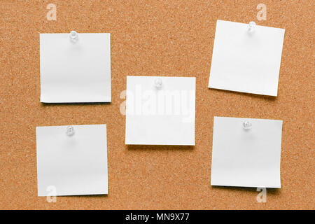 empty square green and yellow pinned sheet on a brown cork reminder Stock Photo