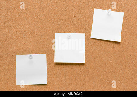 empty square green and yellow pinned sheet on a brown cork reminder Stock Photo