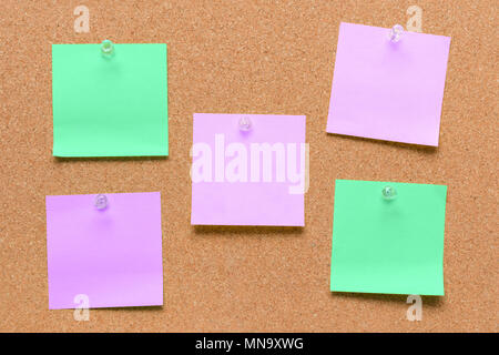 empty square green and purple pinned sheet on a brown cork reminder Stock Photo