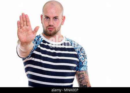 Studio shot of young bald muscular man Stock Photo