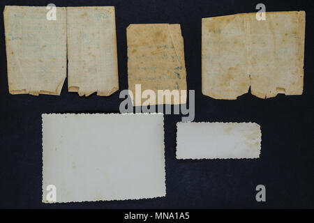 Old and aged document and photo on black background surface Stock Photo