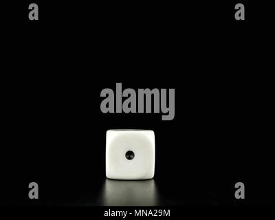 Game die isolated against black background, face with number one Stock Photo