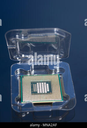 Central processing unit CPU processor microchip in the packaging box on black background Stock Photo