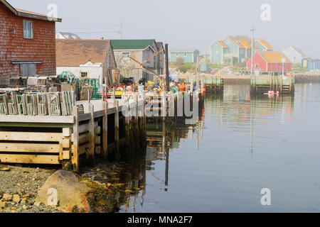 Fog rolling in on Peggy's Cove, the small fishing village in rural Nova Scotia, Canada. Stock Photo