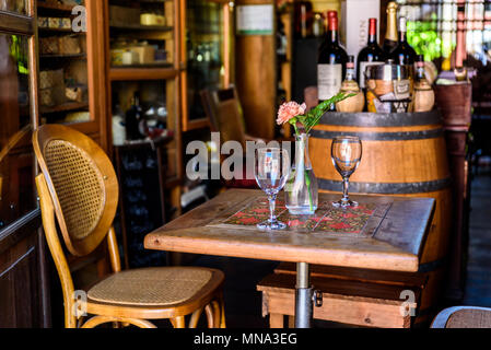 Wine tasting in winery - Wooden barrels and bottles of aged excelent wine Stock Photo