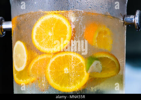 Colorful Orange and Lime Slices in Ice Water Stock Photo