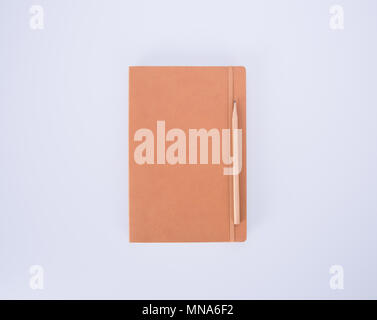 notebook or leather diary and pencil on the blackground Stock Photo