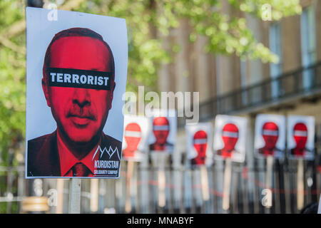 London, UK. 15th May 2018. Kurdish protesters outside Downing street to complain about the visit of Turkish leader Erdogan to the UK.. Posters, attatched to railings, call him a terrorist for his treatment of the Kurds. Credit: Guy Bell/Alamy Live News Stock Photo