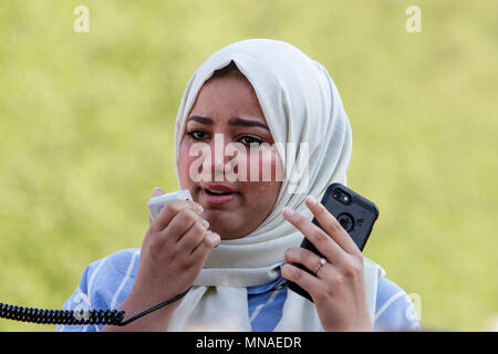 Bristol, UK. 15th May, 2018. Tears are shown running down the face of a bristol student as she talks to the crowd about the disabled and wheelchair-bound activist Ibraheem Abu Thuraya who was one of four Palestinians killed during Friday’s violent clashes in Gaza. The protest march and rally was held to allow people to show their support and solidarity with the Palestinian people after 70 Years of Nakba and to protest about Israel's recent actions in Gaza. Stock Photo
