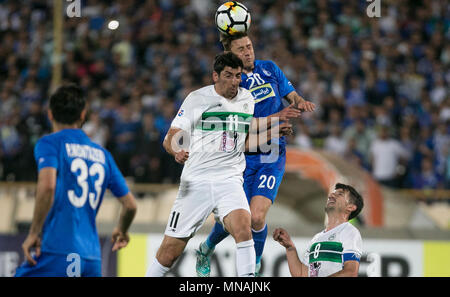Tehran, Iran. 15th May, 2018. Server Djeparov (Top R) of Esteghlal vies with Morteza Tabrizi (Top L) of Zobahan during the round 16 of AFC Asian Champions League football match between Iran's Esteghlal and Zobahan at Azadi Stadium in Tehran, Iran, May 15, 2018. Esteghlal won 3-1. Credit: Ahmad Halabisaz/Xinhua/Alamy Live News Stock Photo