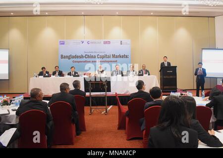 Dhaka. 16th May, 2018. Photo taken on May 15, 2018 shows the roundtable discussion on 'Bangladesh-China Capital Markets' held in Dhaka, capital of Bangladesh. The Roundtable, which has been designed to facilitate the exchange of ideas and experiences in the field of share market matters, was attended by high-level participants from the government, regulators, representatives from Bangladeshi and Chinese premier bourses, financial institutions, economic experts and journalists. Credit: Xinhua/Alamy Live News Stock Photo