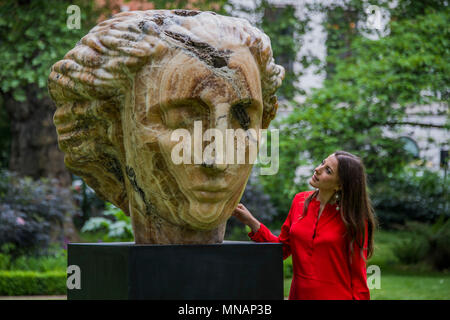 London, UK. 16th May 2018. Emily Young, Cautha, 2012 - Christie’s will present ‘Sculpture in the Square’ an outdoor sculpture garden set within St James’s Square, London, on view to the public from 17 May to 20 June 2018. Credit: Guy Bell/Alamy Live News Stock Photo