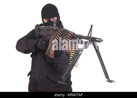 mercenary in black uniforms with machine gun Stock Photo